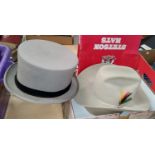 A Stetson hat, size 7 3/4, in original box; a grey top hat, size 7 3/4