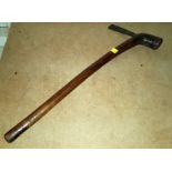 A carved wood Tribal Axe, with a thin metal head, cross hatched marking to the base, Length 51cm.