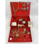 A selection of costume jewellery including large gilt brooches, diamante bits etc