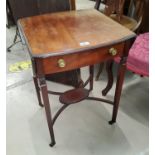 An Edwardian mahogany Pembroke table with oval top, frieze drawer and undertier, on square