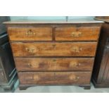 An 18th century oak chest of 3 long and 2 short drawers with brass drop handles, on bracket feet