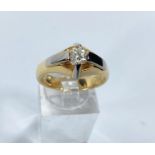 An 18ct gold and white gold solitaire diamond dress ring, diamond approx. 6mm diameter, ring size Q.