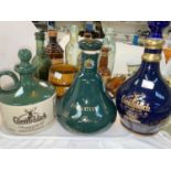 A selection of pottery whiskey decanters by Bell's, etc.; old bottles; etc.