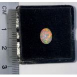 An oval cabochon cut opal, 1 carat