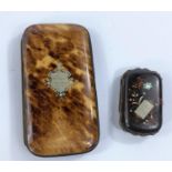 A tortoise shell cigar case with silver central shield