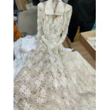 An early 20th century lace wedding dress; various night/christening gowns; etc.