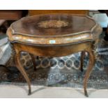 A 19th century oval jardinière table in the Louis XV style, with ormolu mounts, metal liner and