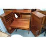A mid 20th century teak 'magic desk' with fold out doors containing interior pull out writing
