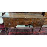 An early 20th century Georgian style sideboard in inlaid and figured mahogany with 6 drawers, on
