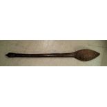 A 19th century carved wooden tribal tool inlaid with detailed white metal decoration length 42cm