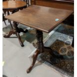 A 19th century mahogany occasional table with rectangular tilt top, on turned column and triple feet