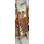 A mahogany framed cheval mirror on splay legs