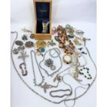 A good selection of costume jewellery, jewellery including gilt diamante and other brooches etc.