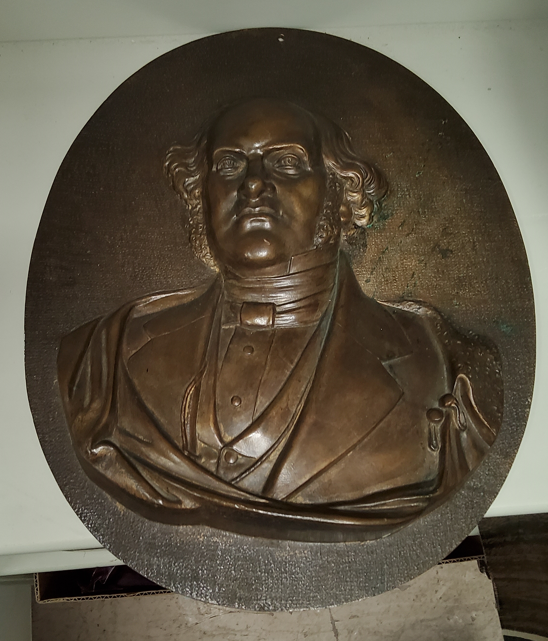 A bronze relief oval plaque of a 19th century gentleman, height 34cm.