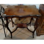 A mahogany rectangular shaped occasional table with under tier