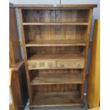 A full height bookcase in satinwood finish with 2 central drawers,  by John Lewis
