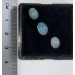 Three oval cabochon cut opals, 3.05 carats