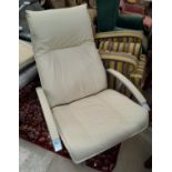 A swivel armchair and pouffe in cream hide by John Lewis