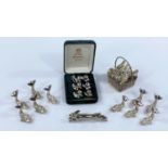 A Selection of silver plated menu holders etc in the form of fish, ducks and others