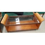 A mid 20th century G-plan teak 'Lotus' coffee table with glass top and solid shelf under