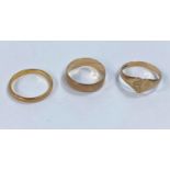 A 22 carat hallmarked gold wedding ring, 2.2 gm; a 9 carat hallmarked gold wedding ring; a 9 carat