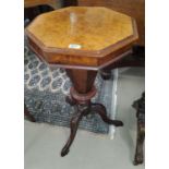 A Victorian burr walnut work table, the octagonal hinged top revealing fitted tapering well, on