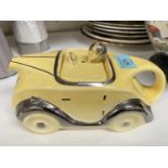A 1930's Sadler style yellow racing car teapot