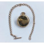 A curb chain Albert, the clip and bar stamped '9c'; a gold plated Waltham pocket watch, tests as