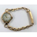 A ladies 9 carat hallmarked gold wristwatch on 9 carat expanding strap, net weight 11.4 gm