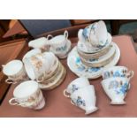 A Colclough 21 piece part tea set and a Paragon part tea set