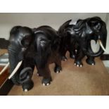 Two ebony elephants, height 25cm (both have cracks)