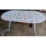 A large Victorian style oval cast metal garden table length 185cm