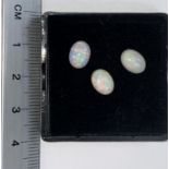 Three oval cabochon cut opals, 2.33 carat total