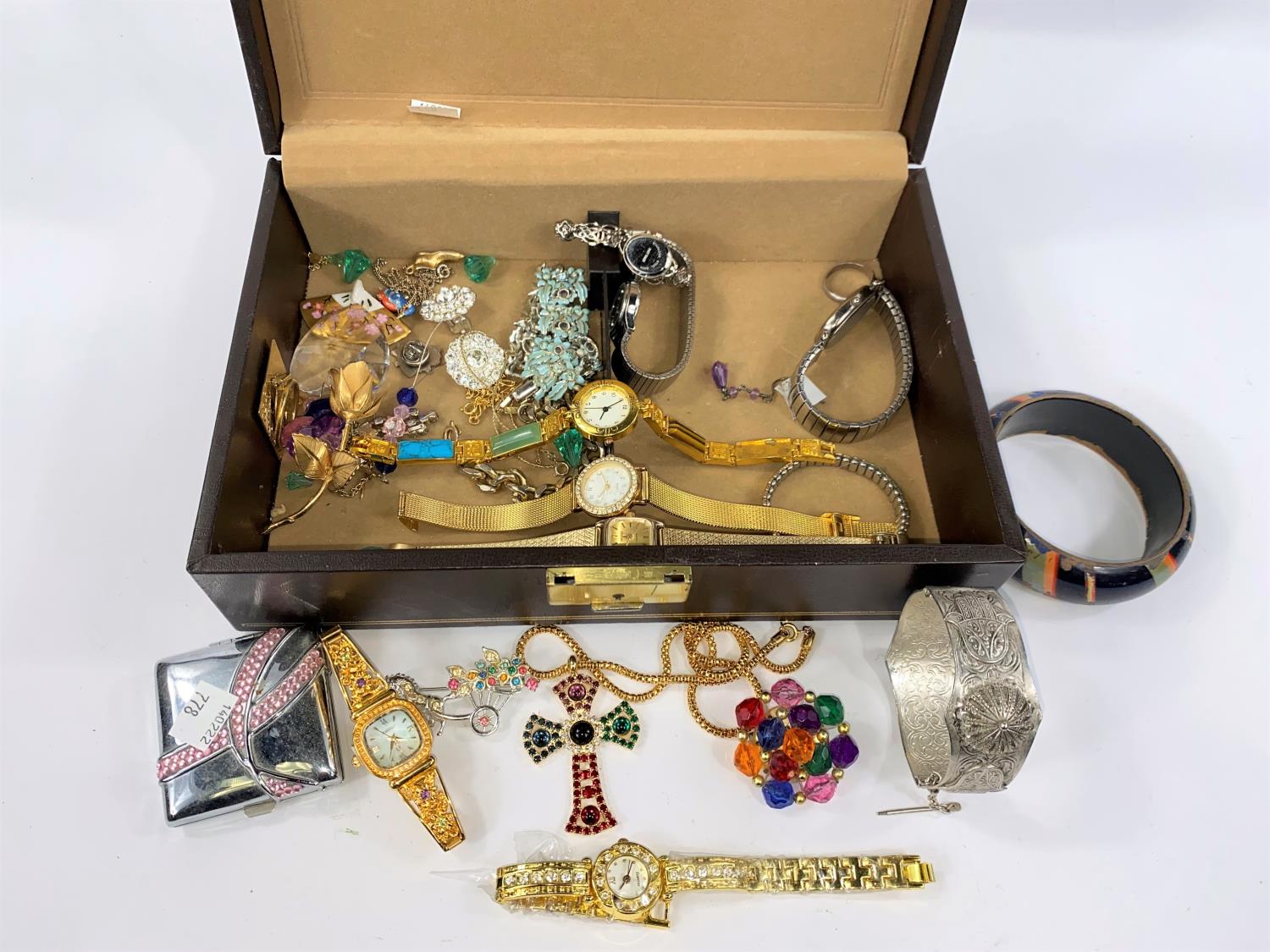 A jewellery box with 9 ladies watches; costume jewellery