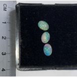 Three oval cabochon cut opals, 1.66 carats