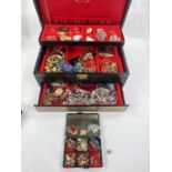 A good selection of costume jewellery, watches etc. in a jewellery box.
