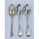 A pair of chased hallmarked silver table spoons, London 1796; a bottom marked table spoon (marks