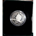 A 2000 commemorative Queen Mother £5 silver coin