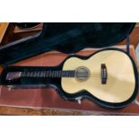 An 'Ash' hand made acoustic guitar in carry case