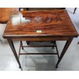 An Edwardian inlaid mahogany rectangular fold over card table on square tapering legs, width 24"