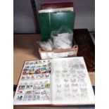 Two stockbooks with stamps; 2 packets of British stamps; 9 empty stockbooks; etc..