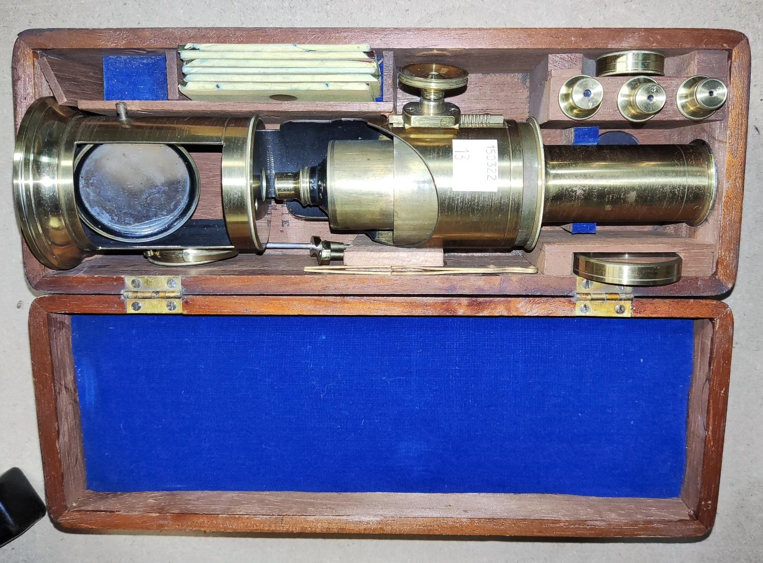 A field microscope in mahogany case, with spare lenses and slides, etc., by Lennie Edinburgh