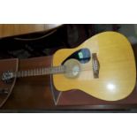 A Yamaha F310 acoustic guitar