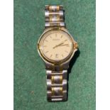 A two tone stainless steel and gilt GUCCI unisex wristwatch with swiss quartz movement, gilt