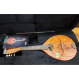 A vintage D Day mandolin in carry case