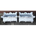 A pair of white cast metal traditional style planters