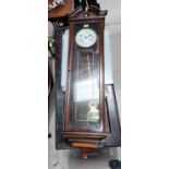 A mahogany cased Vienna wall clock with double weight drive movement