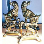 A pair of brass dragon fire dogs; a pair of seated dog doorstops