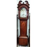 An early 19th century oak longcase clock with mahogany crossbanding, the hood with arched dentil