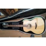 A Turner 000 style acoustic guitar in spruce, mahogany and ovangkol, with Gator flight case